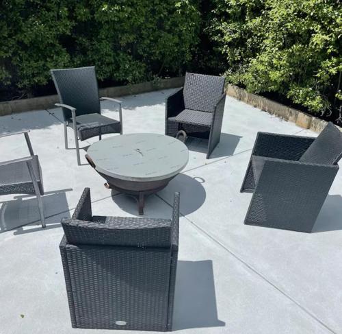 a group of chairs and a table and chairs at Beach House Getaway 2 in Smiths Beach