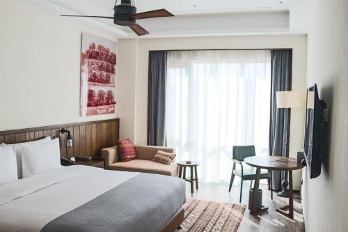 Postel nebo postele na pokoji v ubytování Yan'an Wanda Meihua Hotel