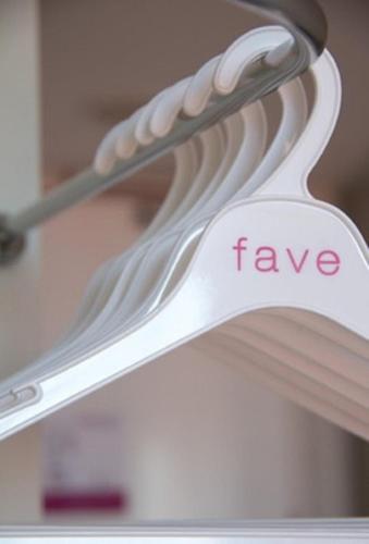 a white spoon with the word rave written on it at favehotel Graha Agung Surabaya in Surabaya