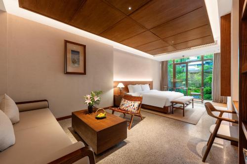 Krevet ili kreveti u jedinici u okviru objekta Chengdu Guiyuan Hotel
