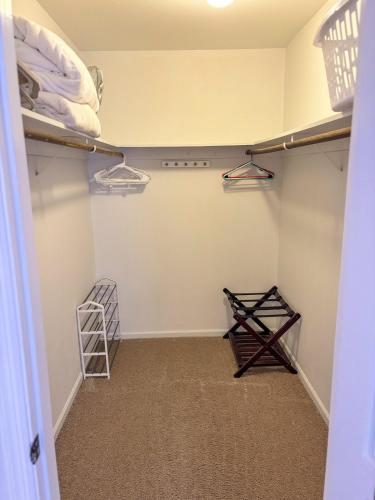 a walk in closet with two shelves and a ladder at Sun Dazed Tempe with Cali Soul Vibe in Tempe
