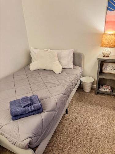 a bed with two pillows on it in a room at Sun Dazed Tempe with Cali Soul Vibe in Tempe