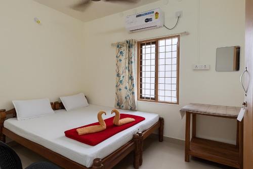 Ένα ή περισσότερα κρεβάτια σε δωμάτιο στο Golden Beach Home Stay