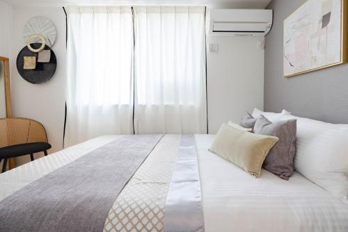 Giường trong phòng chung tại Hotel-Like Simmons Bed Couple Disney Shinjuku