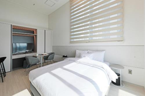 Katil atau katil-katil dalam bilik di Sota Suite Pyeongtaek Godeok branch