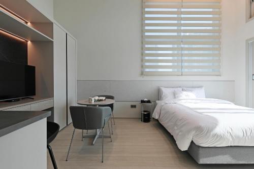 Katil atau katil-katil dalam bilik di Sota Suite Pyeongtaek Godeok branch