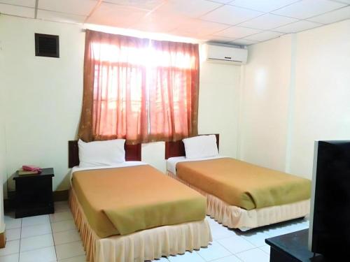 Postel nebo postele na pokoji v ubytování Souvanna 2 Hotel