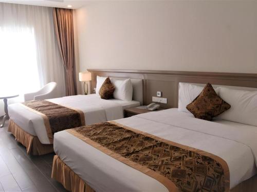 Katil atau katil-katil dalam bilik di Hoa Binh - Rach Gia Resort