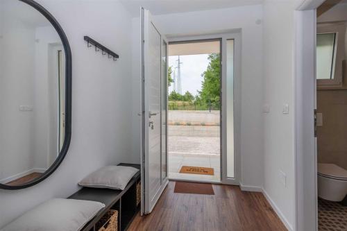 a bathroom with a mirror and a sink at Villa Grace, a romantic single story villa with a pool in VeliGolji