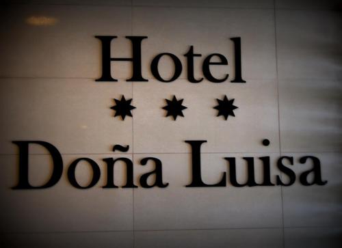 a sign for a hotel bomla club at Hotel Doña Luisa in San Luis de Sabinillas
