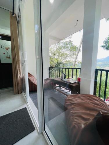 a glass room with a view of a balcony at Ella Hillcrest Heaven-Free Pickup from Ella in Ella