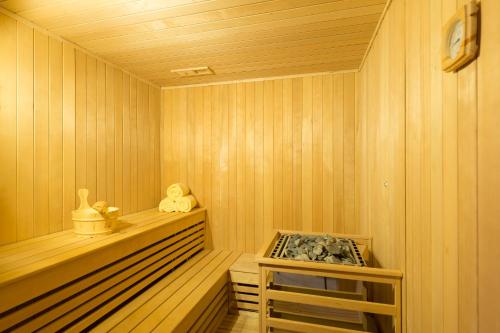 a sauna with a bench in a wooden room at The Haven Khao Lak in Khao Lak
