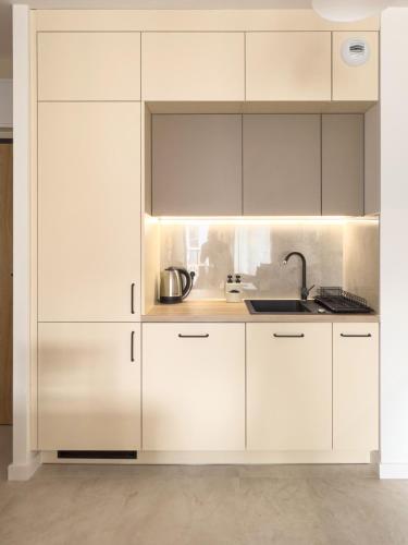 Dapur atau dapur kecil di Waterloo Apartment