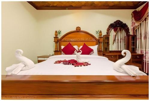 Кровать или кровати в номере Vy Chhe Hotel