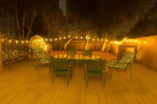 a patio with a table and chairs and lights at Long stay Google BBQ BIG yard in Mountain View