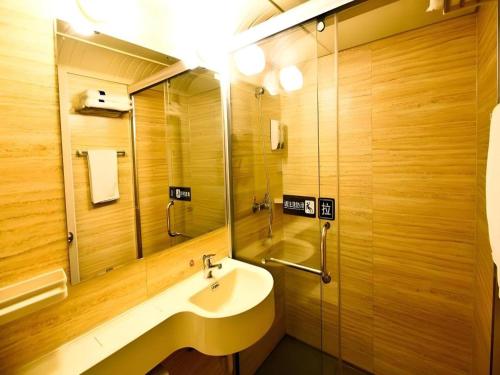 a bathroom with a sink and a mirror at 7 Days Inn Xi'an North Economic Development Zone 4th Fengcheng Road in Xi'an