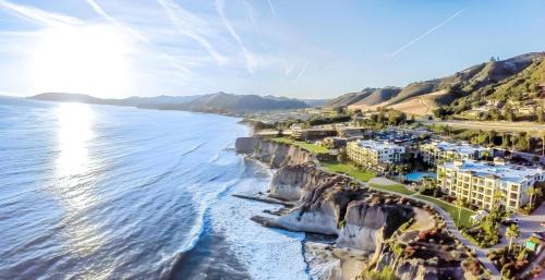 an aerial view of the cliffs next to the ocean at Dolphin Bay Resort and Spa in Pismo Beach