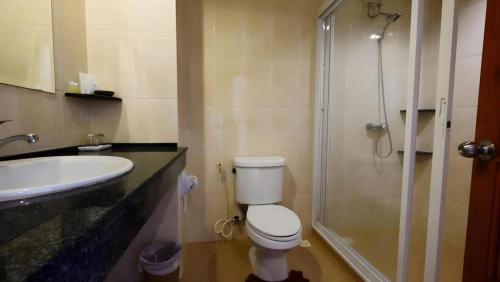 a bathroom with a shower and a toilet and a sink at Phu View Talay Resort in Pattaya South