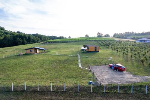 an aerial view of a farm with a car parked in a field at Seosko Domaćinstvo Protic , Prijedor , Veliko Palančište in Velika Palančište