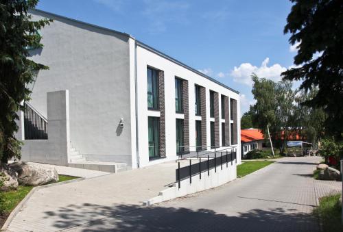 a white building with windows on the side of it at Country Inn Suitenhotel in Werder