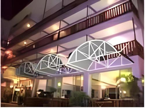 a building with two balconies on the side of it at Erawan Place in Mae Sot