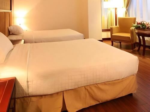 Кровать или кровати в номере CWD Hotel