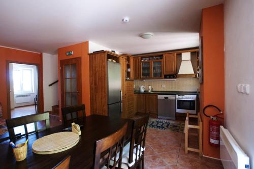 a kitchen with a table and a dining room at Chalupa - Sklep Starovice in Starovice