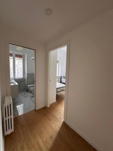an empty room with a living room with a mirror at Emilù Guest House in Pescara