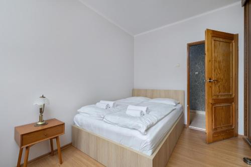 Кровать или кровати в номере Przytulne Apartamenty w Klimatycznym Domu nad Białką w Otoczeniu Górskich Krajobrazów by Noclegi Renters