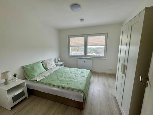 Postel nebo postele na pokoji v ubytování Apartmány Wolkenstein