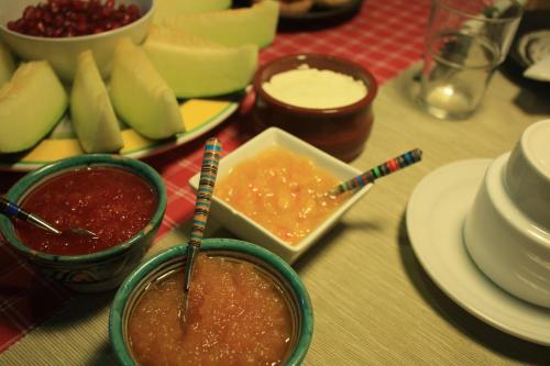 a table topped with plates and bowls of food with chopsticks at El Cobijo de Vejer in Vejer de la Frontera
