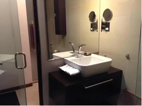 a bathroom with a sink and a mirror at D Villas in Colombo