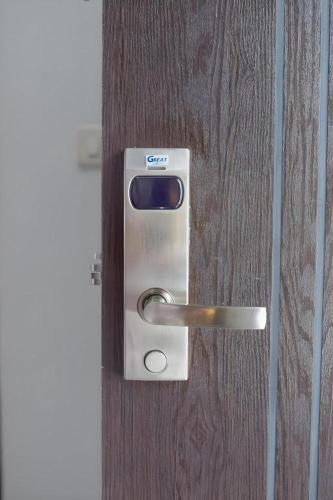 a close up of a door with a lock on it at Thanburi Hotel in Udon Thani