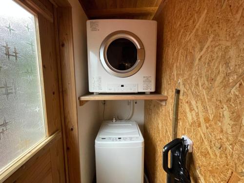 a washer and dryer in a tiny house at BIRD-LOGG Amami in Amami