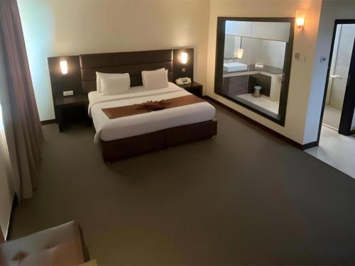Voodi või voodid majutusasutuse The BCC Hotel & Residence toas