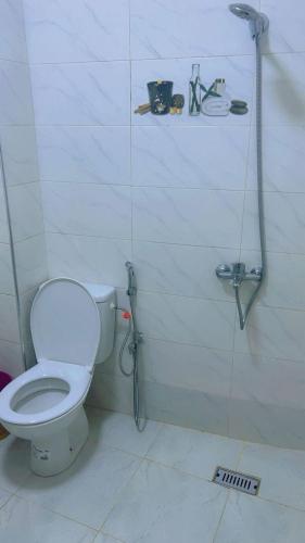 a bathroom with a toilet and a shower at Chic furnished apartment, Center in Tangier
