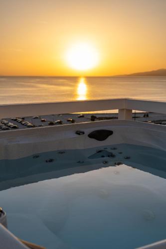 a sunset from the deck of a cruise ship at Numi Suites in Mýkonos City