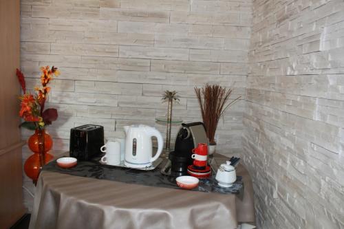 a table in a room with a counter top with at A l'Aube des Volcans in Charbonnières-les-Vieilles