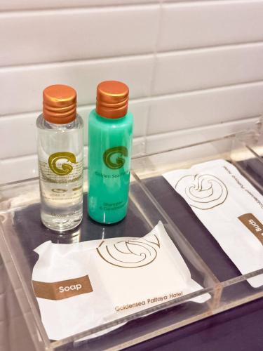 a tray with two bottles of water and a towel at Golden Sea Pattaya - SHA Extra Plus in Pattaya Central