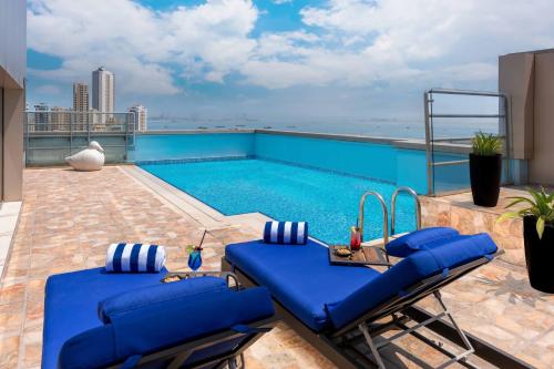 a swimming pool on the roof of a building at The K Hotel in Manama