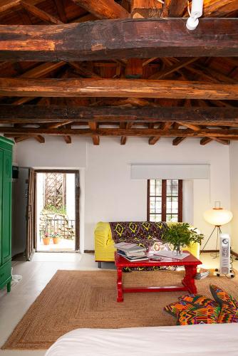 a living room with a couch and a table at The Pelion Manifesto 2 in Agios Georgios Nilias