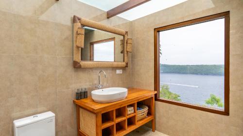 a bathroom with a sink and a window at Limitless Tent Nusa Penida in Toyapakeh