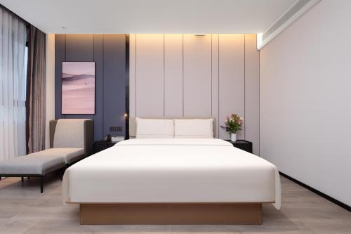 Cama o camas de una habitación en Atour Hotel Wenling Zeguo Lingyue Plaza