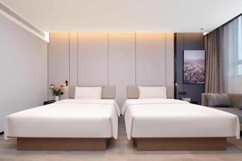 Cama o camas de una habitación en Atour Hotel Wenling Zeguo Lingyue Plaza
