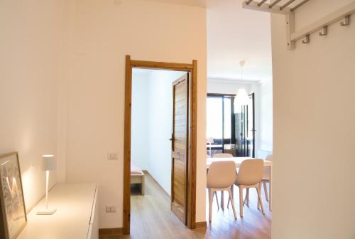 a kitchen and dining room with a table and chairs at CaLolden in Ballabio
