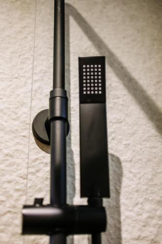 a black pole with a light on top of it at Karma Chic&Style Intera Villa in Korçë