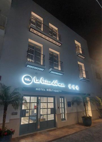a hotel sign on the side of a building at Hotel Boutique La Brisa del Mar in Estepona