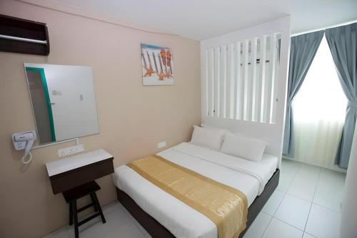 Ένα ή περισσότερα κρεβάτια σε δωμάτιο στο Skyview Hotel