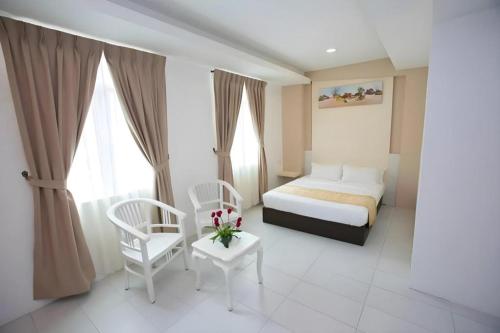 Ένα ή περισσότερα κρεβάτια σε δωμάτιο στο Skyview Hotel