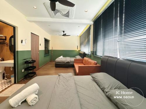 a living room with a bed and a couch at Jalan Rusa Happy hour 10pax KTV Walkable to KSL Mall Johor Bahru in Johor Bahru